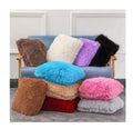 Cojines decorativos de peluche en varios colores
